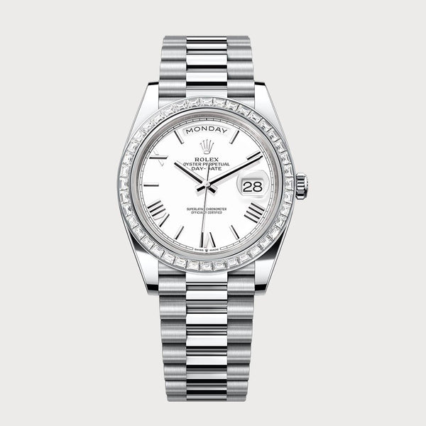 Rolex Day-Date 40 With White Roman Dial & Baguette Diamond Bezel In Platinum