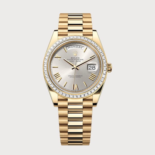 Rolex Day-Date 40 Silver Roman Dial With Baguette Diamond Bezel In Yellow Gold