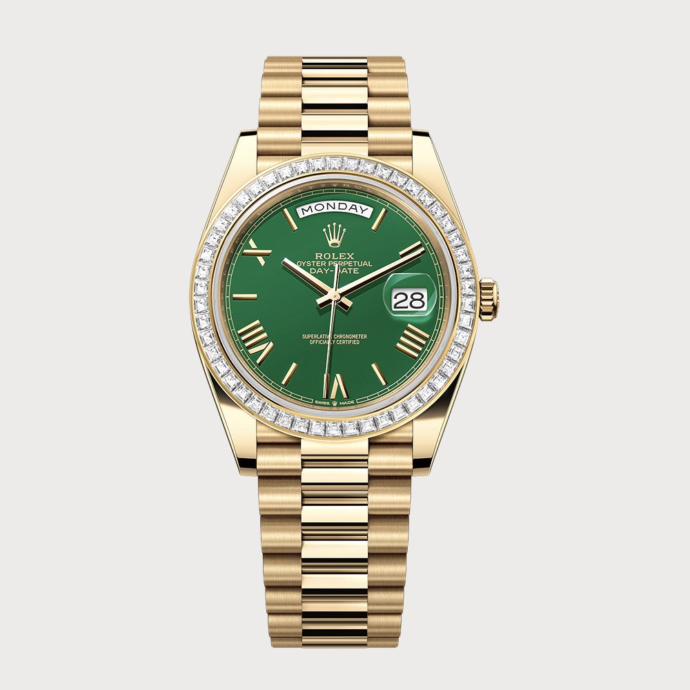 Rolex Day-Date 40 Green Roman Dial With Baguette Diamond Bezel In Yellow Gold