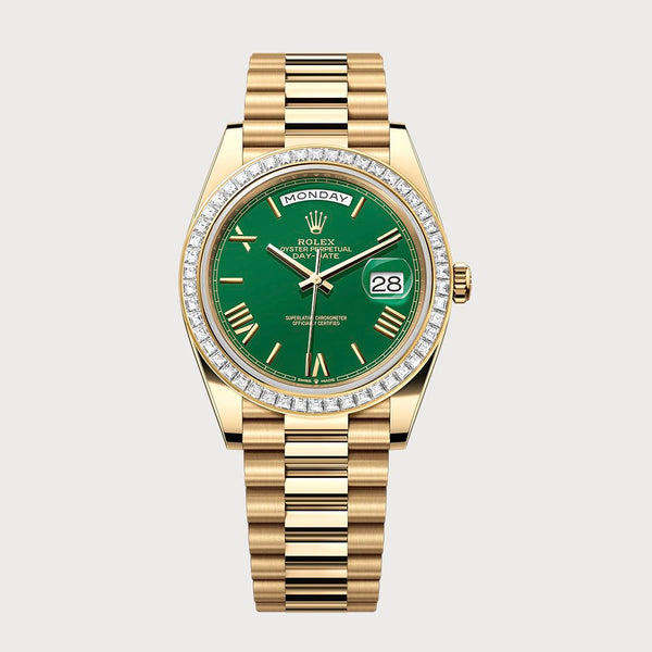 Rolex Day-Date 40 Green Roman Dial With Baguette Diamond Bezel In Yellow Gold