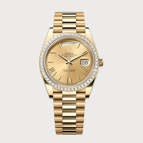 Rolex Day-Date 40 Roman Champagne Dial & Baguette Diamond Bezel In Yellow Gold